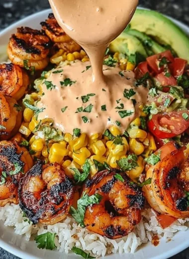 Grilled shrimp bowl with avocado, corn salsa, and creamy sauce
