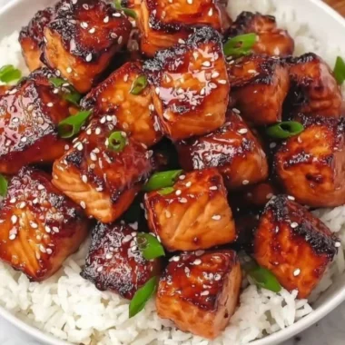 Delicious Honey Garlic Salmon Bites served in a colorful bowl with fresh vegetables