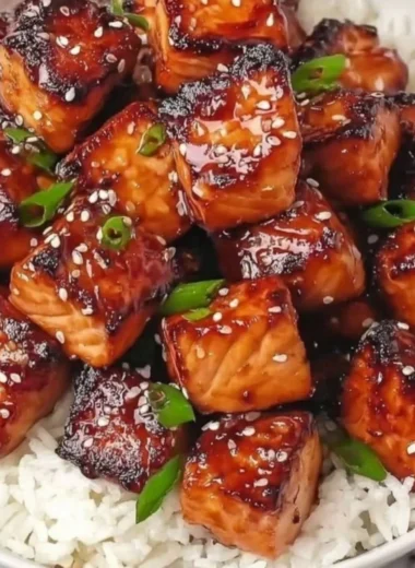 Delicious Honey Garlic Salmon Bites served in a colorful bowl with fresh vegetables