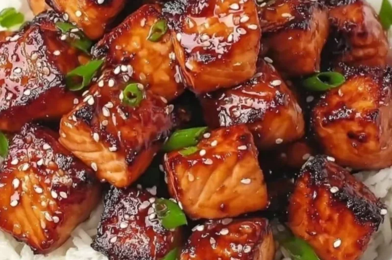 Delicious Honey Garlic Salmon Bites served in a colorful bowl with fresh vegetables