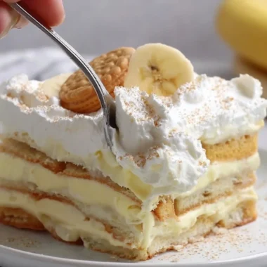 Delicious layered banana pudding dessert with whipped cream and bananas
