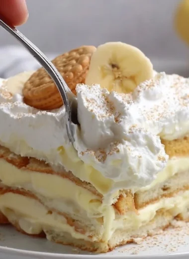 Delicious layered banana pudding dessert with whipped cream and bananas