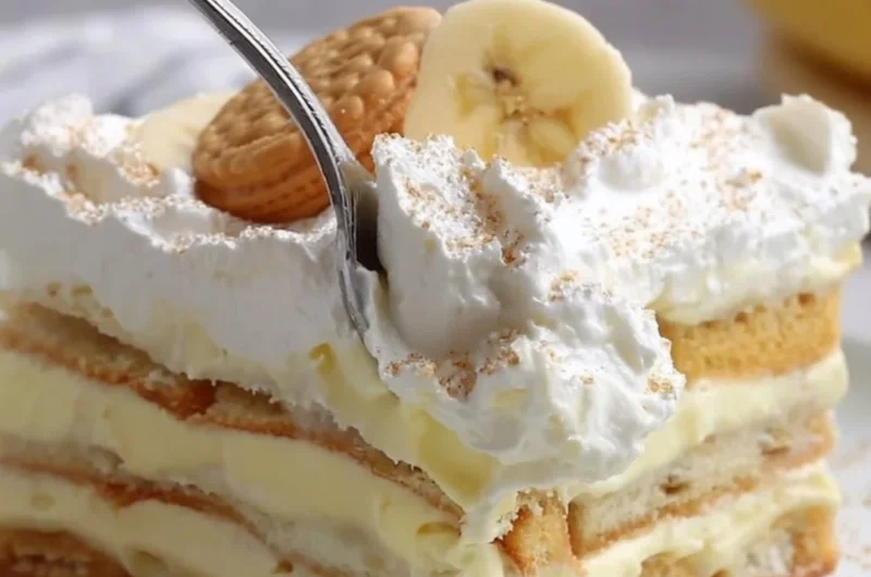 Delicious layered banana pudding dessert with whipped cream and bananas