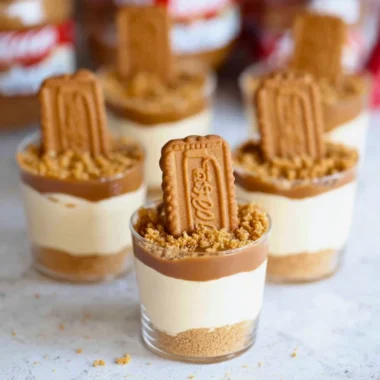 Delicious no bake Biscoff cheesecake cups topped with cookie crumbles