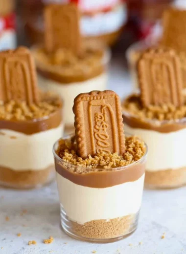 Delicious no bake Biscoff cheesecake cups topped with cookie crumbles