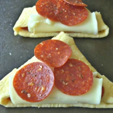 Homemade Pizza Roll-Ups filled with cheese and pepperoni on a plate
