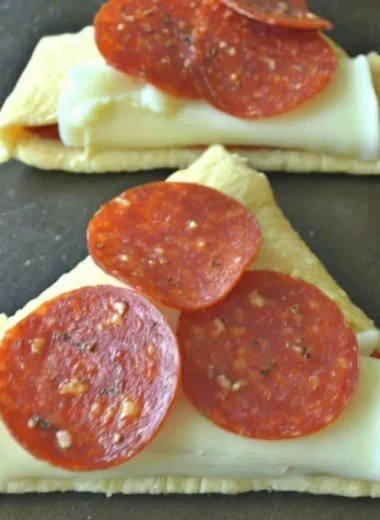Homemade Pizza Roll-Ups filled with cheese and pepperoni on a plate