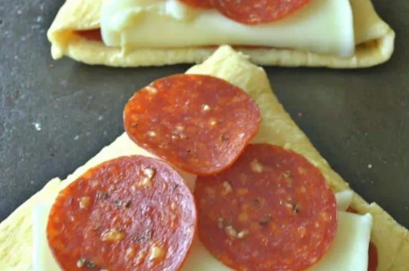 Homemade Pizza Roll-Ups filled with cheese and pepperoni on a plate