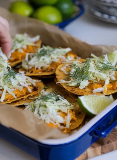 Smashed Buffalo Chicken Tacos with Ranch Slaw on a wooden serving board