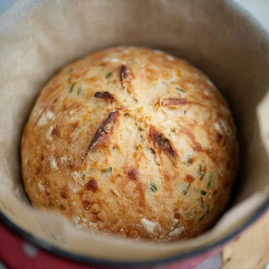 Freshly baked sourdough jalapeño cheddar artisan bread with a crispy crust
