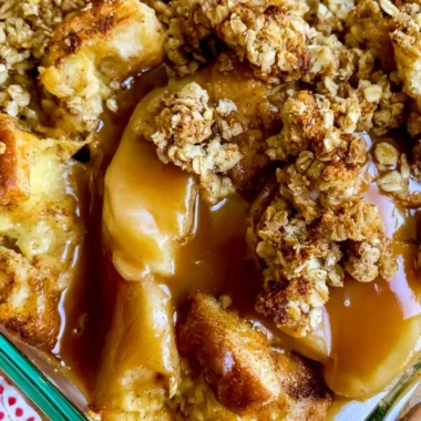 Apple Pie French Toast Casserole topped with cinnamon and apples