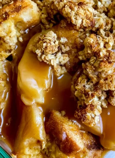 Apple Pie French Toast Casserole topped with cinnamon and apples