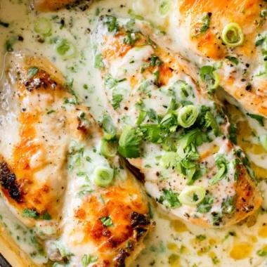 Delicious Coconut Lime Chicken garnished with lime wedges and herbs