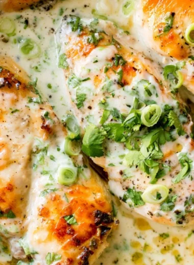 Delicious Coconut Lime Chicken garnished with lime wedges and herbs