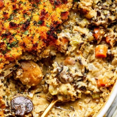 Creamy chicken wild rice casserole served in a dish with vegetables