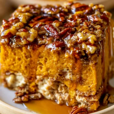 Pumpkin Cottage Cheese Breakfast Bake topped with nuts and spices