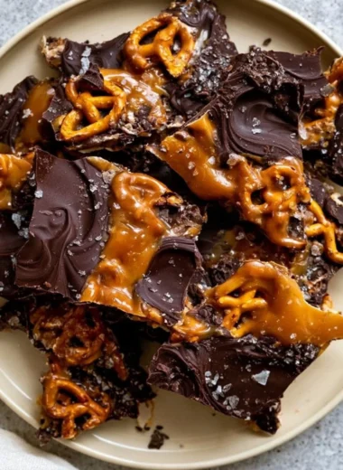 Delicious salted caramel chocolate pretzel bars topped with drizzled chocolate.