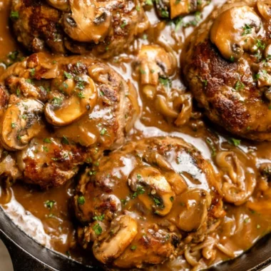 Delicious homemade Salisbury steak served with rich gravy and mashed potatoes.