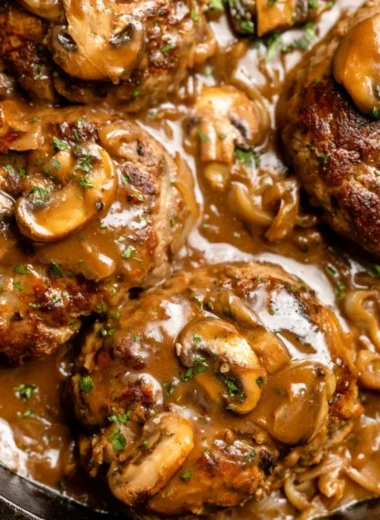 Delicious homemade Salisbury steak served with rich gravy and mashed potatoes.