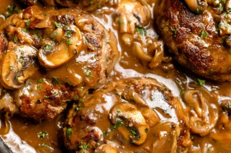 Delicious homemade Salisbury steak served with rich gravy and mashed potatoes.