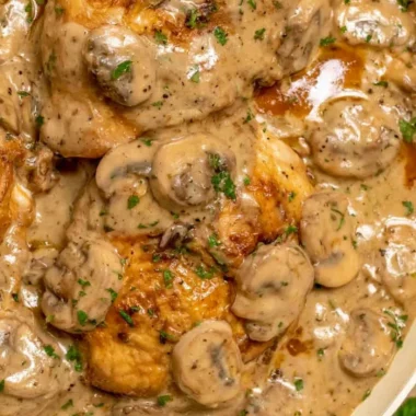 Delicious chicken marsala with rich sauce and tender chicken breast served on a plate.